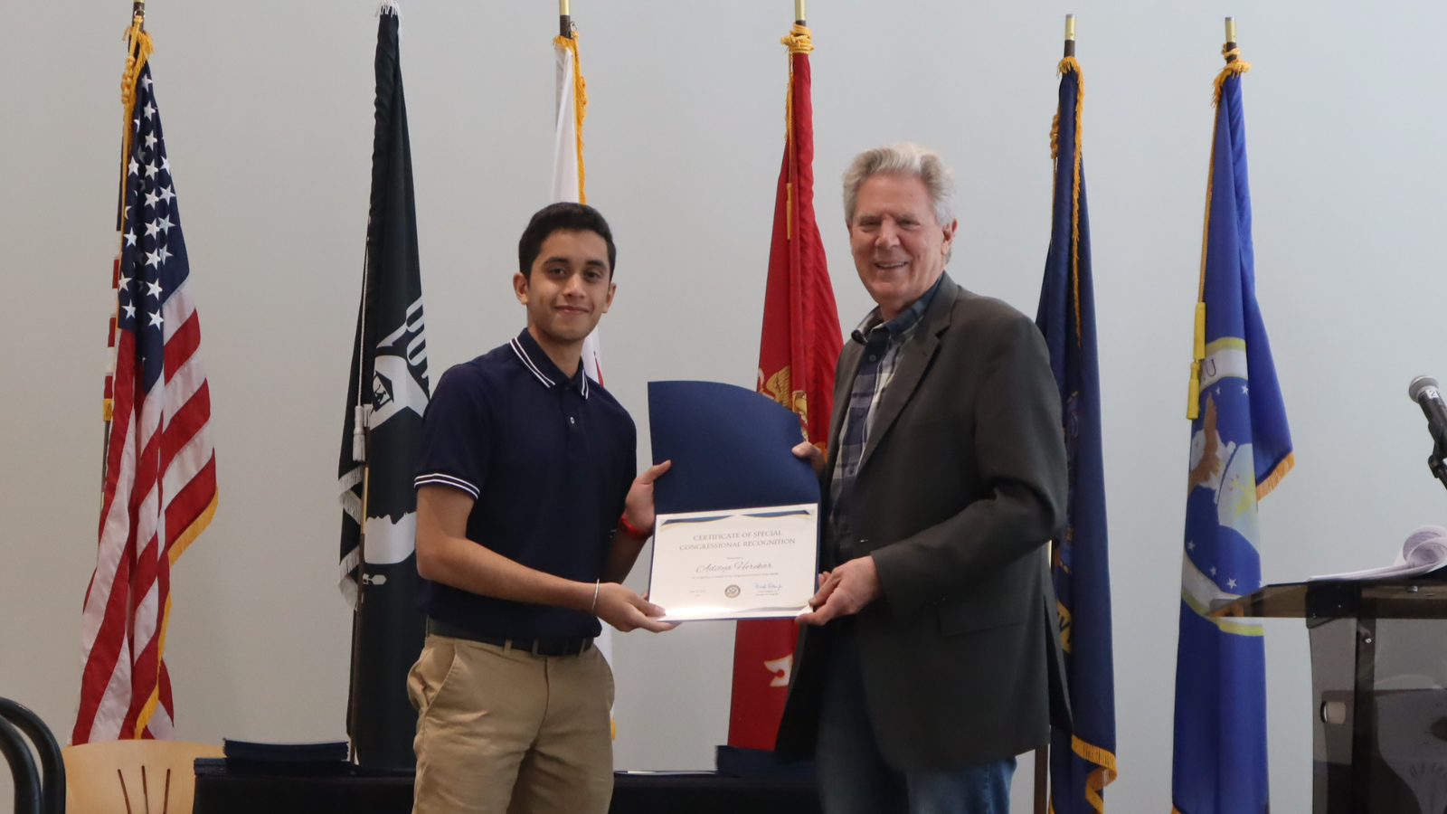 Aditya Herekar receiving congressional recognition from Rep. Frank Pallone